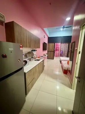 a kitchen with pink walls and a refrigerator at Hello Kitty HomeStay - Cameron Highlands - Spacious Studio - Perfect for Families - Sleeps 4 and Baby in Tanah Rata