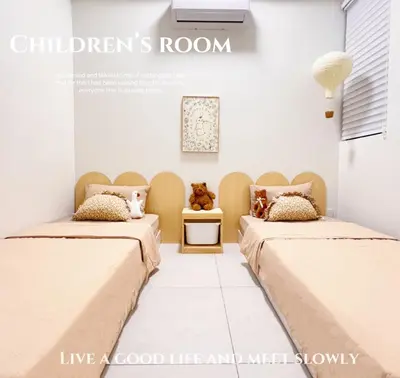 two beds in a hospital room with teddy bears at Georgetown Seaview & Cityview Skypool with 2 Carpark in Jelutong