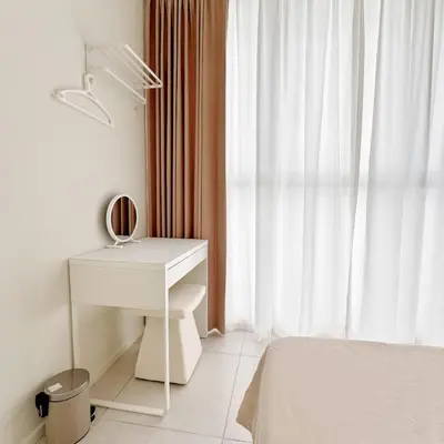 a bedroom with a white desk and a window at Georgetown Seaview & Cityview Skypool with 2 Carpark in Jelutong