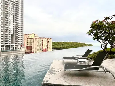 a swimming pool with chairs on top of a building at Georgetown Seaview & Cityview Skypool with 2 Carpark in Jelutong