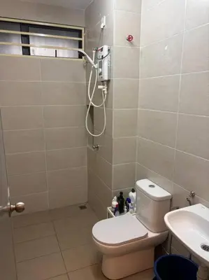 a bathroom with a shower with a toilet and a sink at Hz homestay in Simpang Ampat