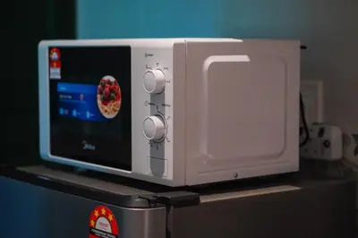 a white microwave sitting on top of a refrigerator at Anderson Mountain View by Xuites-6 Pax-Free Netflix-6 mins to Concubine Lane in Ipoh