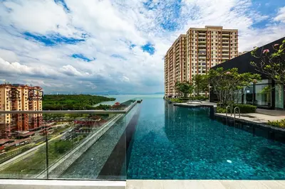 a view of a river in a city with buildings at UA19 #3BR 3 Queen Bed #Family Staycation in Jelutong