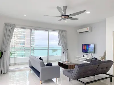 a living room with a couch and a ceiling fan at 2bedroom 2bath 13th Seaview MansionOne Gurney in George Town