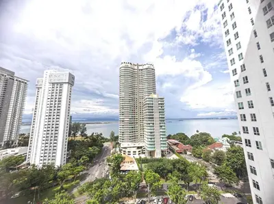 a group of tall buildings in front of the water at 2bedroom 2bath 13th Seaview MansionOne Gurney in George Town