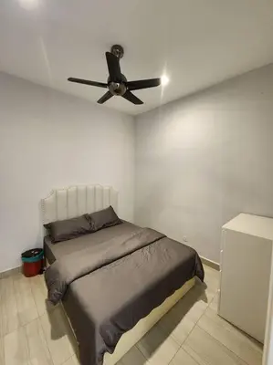 a bedroom with a bed and a ceiling fan at 5min to juru & bukit minyak industrial semi D in Bukit Mertajam