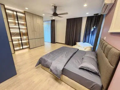 a bedroom with a large bed and a couch at 5min to juru & bukit minyak industrial semi D in Bukit Mertajam
