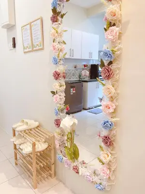 a room with a wall decorated with flowers at The Floral Dawn Anderson in Kampong Simee