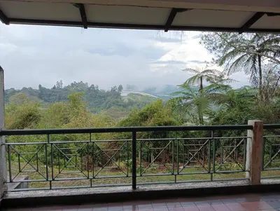 a view from the balcony of a house at Cozy Nest 1 Bedroom Apartment at Equatorial Hill Resort in Brinchang