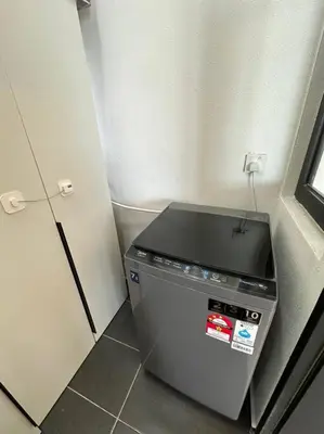 a small refrigerator in a corner of a room at PICO VR, 3BR 3 queen bed, 2 car park, UrbanSuites by XW Home in Jelutong