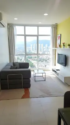 a living room with a couch and a large window at 23th 2BR1B Straits Garden Suites Georgetown Jelutong in Jelutong
