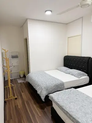 a bedroom with two beds in a room at TuR15 SPlCE 10pax 4room Private House in Bayan Lepas