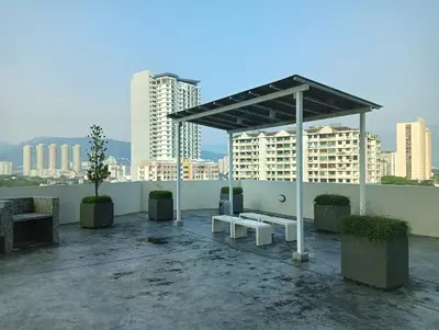 a pavilion with a bench on a rooftop with buildings at 29th 2BR1B Straits Garden Suites Georgetown Penang in George Town