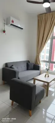 a living room with a couch and a table at Ipoh Anderson Free WiFi & Tvbox 4ppl in Ipoh