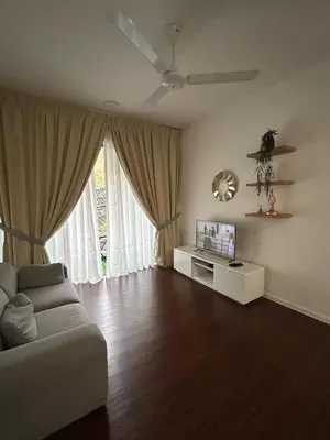 a living room with a couch and a tv at Raissa Resident palas horizon Cameron Highlands in Brinchang