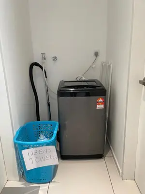 a room with a trash can next to a cooler at Sunway Onsen Ipoh Tambun Cozy Retreat 8pax in Tambun