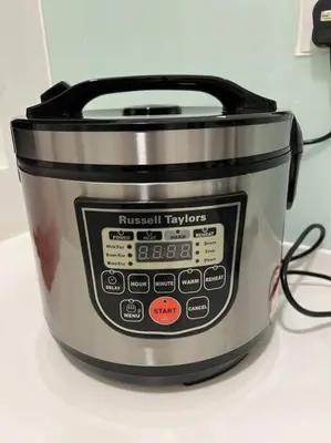 a metal slow cooker sitting on top of a counter at Sea Breeze Haven 2BR Seaview w Bathtub 海风乐园海景套房 by Minsù in Tanjong Tokong