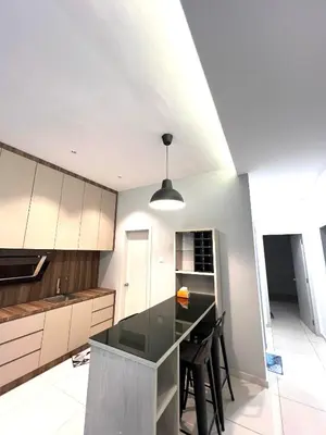 a kitchen with a black counter top in a room at The Horizon Ipoh 3BR MAGNOLIA -by Goswell in Ipoh