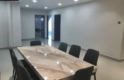 a conference room with a wooden table and chairs at Orkid Apartment Ringlet in Cameron Highlands