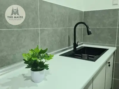 a kitchen sink with a potted plant on a counter at The Cove Hillside Residence Ipoh-Nature On Earth in Ipoh