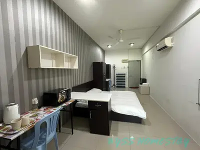 a hospital room with a bed and a sink in it at BYSS Homestay Studio in Kampar