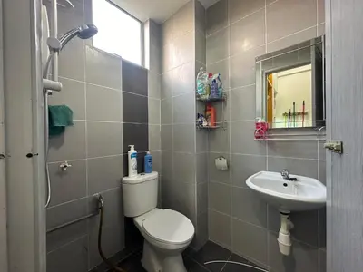 a bathroom with a toilet and a sink at BYSS Homestay Studio in Kampar