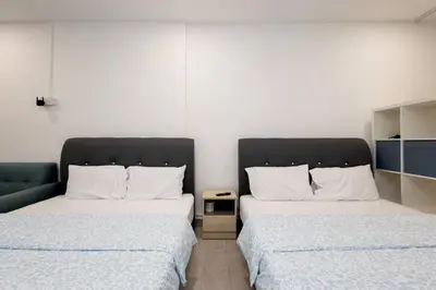 two beds sitting next to each other in a room at Casa for 4 - Private Studio Ipoh in Ipoh