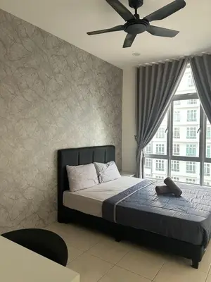 a bedroom with a bed with a ceiling fan at the Anderson Ipoh 2BR by Goswell in Ipoh