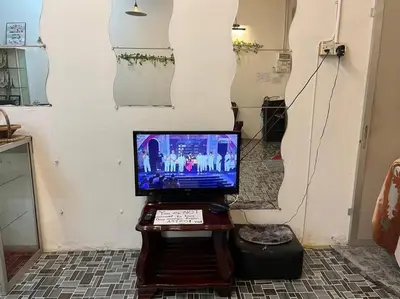 a computer sitting on a table in a room at Near Aeon Taiping and Taiping Sentral Mall in Kamunting