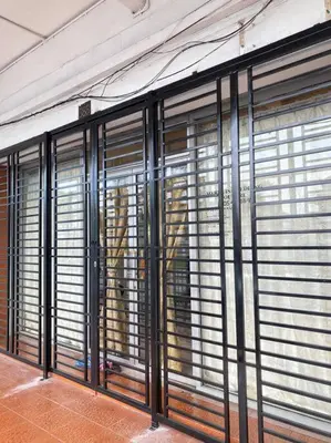 a group of windows with blinds in a building at Near Aeon Taiping and Taiping Sentral Mall in Kamunting