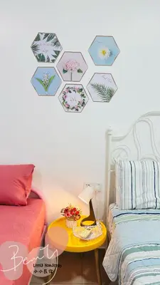 a bedroom with two beds and a table with a lamp at Little Homestay - \u5c0f\u5c0f\u6c11\u5bbf in Ipoh