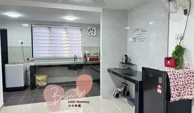 a kitchen with a sink and a refrigerator at Little Homestay - \u5c0f\u5c0f\u6c11\u5bbf in Ipoh