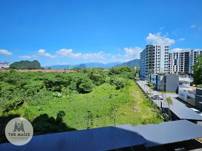 an aerial view of a city with buildings and trees at The Cove Hillside Residence Ipoh - Nostalgic Terracotta in Ipoh