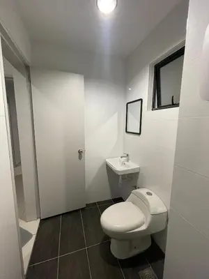 a white bathroom with a toilet and a sink at The Horizon Ipoh 3BR ORCHID - by Goswell in Ipoh
