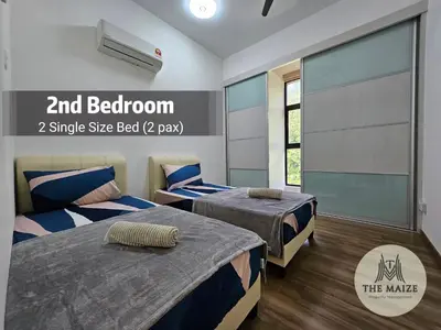 a bedroom with two beds and a window at The Cove Ipoh - Blissful Abodes in Tambun