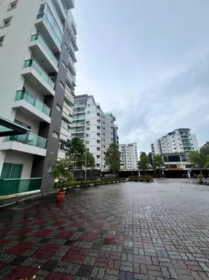 a brick parking lot in a city with tall buildings at LIly Brava 7 in Tanah Rata