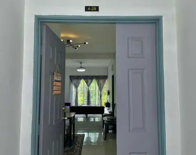 a door leading to a living room with a piano at Ammara Homestay Emerald Avenue Cameron Highlands in Brinchang