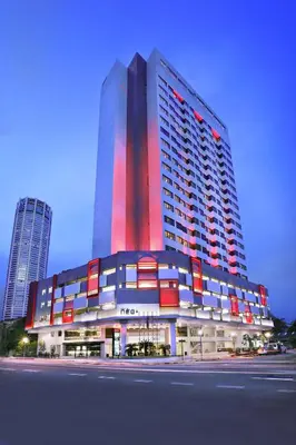 a large building with red lights on the side of it at Neo+ Penang in George Town