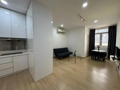 a kitchen and living room with a couch and a table at Netflix Studio Seaview 118Island Plaza in Tanjong Tokong