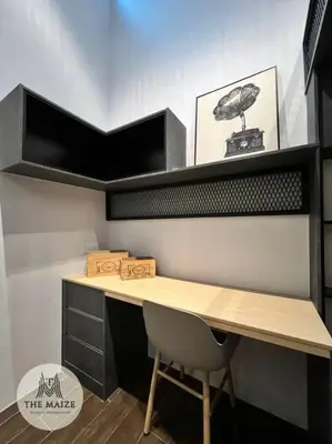 a desk with a chair in a room at The Urban Lodge - Tasek Avenue Ipoh in Ipoh