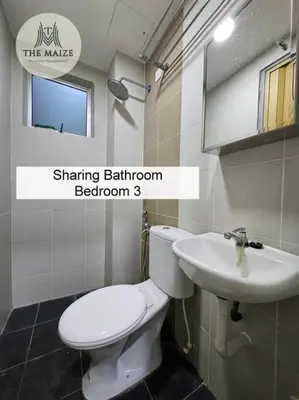 a bathroom with a white toilet and a sink at Cozy Nest - Sky Garden Residence Ipoh in Chemor