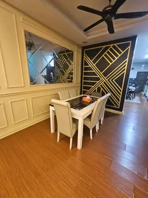 a dining room with a table and chairs and a ceiling at Mysa at Meru Ipoh in Ipoh