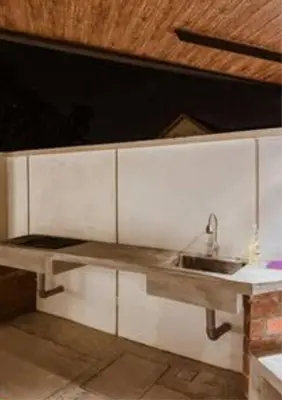 a kitchen with a sink and a counter at Ipoh Tiga Pool Villa by Papahost in Ipoh
