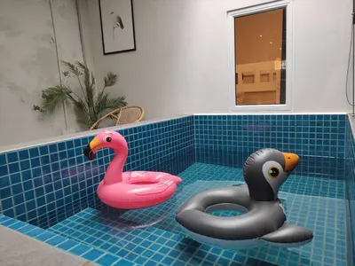 two rubber swans sitting in a tub in a bathroom at Heritage House 2BR with Dipping Pool in Town walkto Street Art 47 in George Town