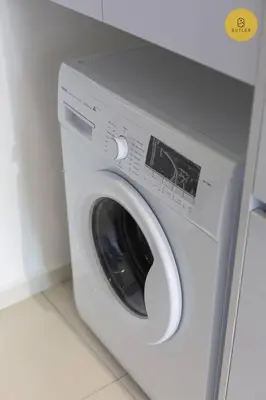 a white washing machine in a room at Greatview 2BR Infinity Pool & EasyAccess to Town 13 in George Town