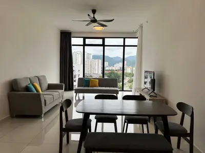 a living room with a table and a couch at Greatview 2BR Infinity Pool & EasyAccess to Town 13 in George Town