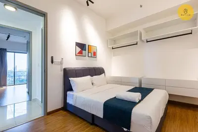 a bedroom with a bed and a glass door at Seaview 2BR Infinity Pool & EasyAccess to Town 191 in George Town