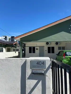 a house with a speed limit sign in front of it at Homestay RumahKita di Seri Iskandar in Seri Iskandar