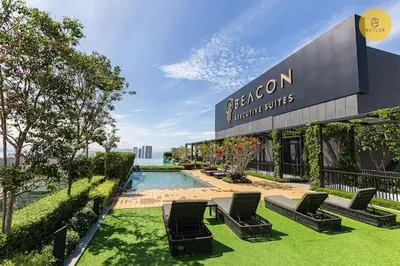 a group of chairs sitting in front of a building at Seaview 2BR Infinity Pool & EasyAccess to Town 201 in George Town