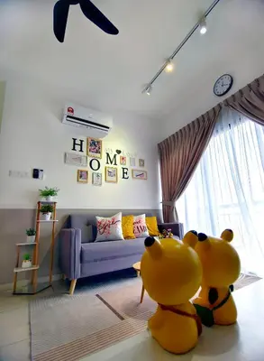 a living room with a large toy animal sitting on the floor at Decozy 9 Ipoh Town Condo 12pax in Ipoh